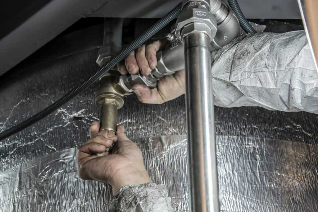 Tulsa Quality Plumbing Services - Plumber replacing pipes.