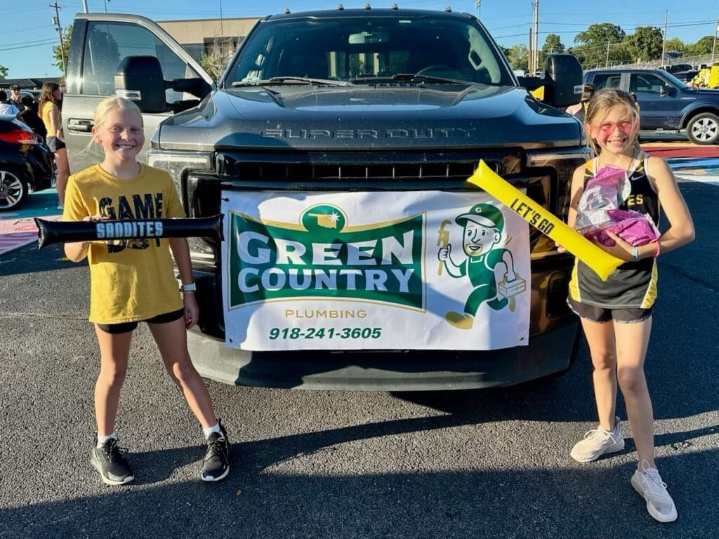 plumber in Sand Springs at Sandites homecoming parade with parade float. most trusted Plumber supporting Sand Springs community