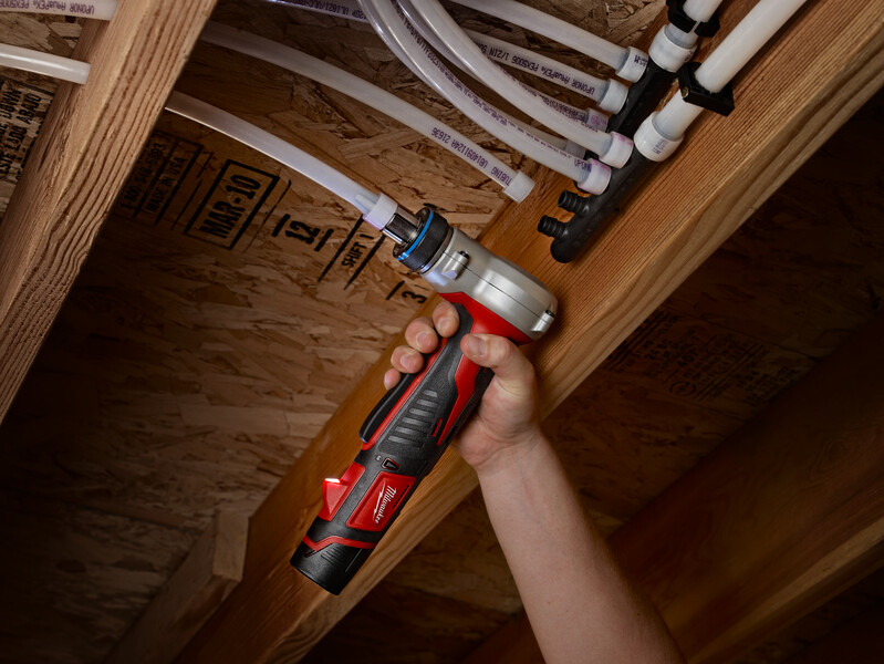 Plumber installing new PEX pipes in a home, highlighting the benefits of modern repiping solutions